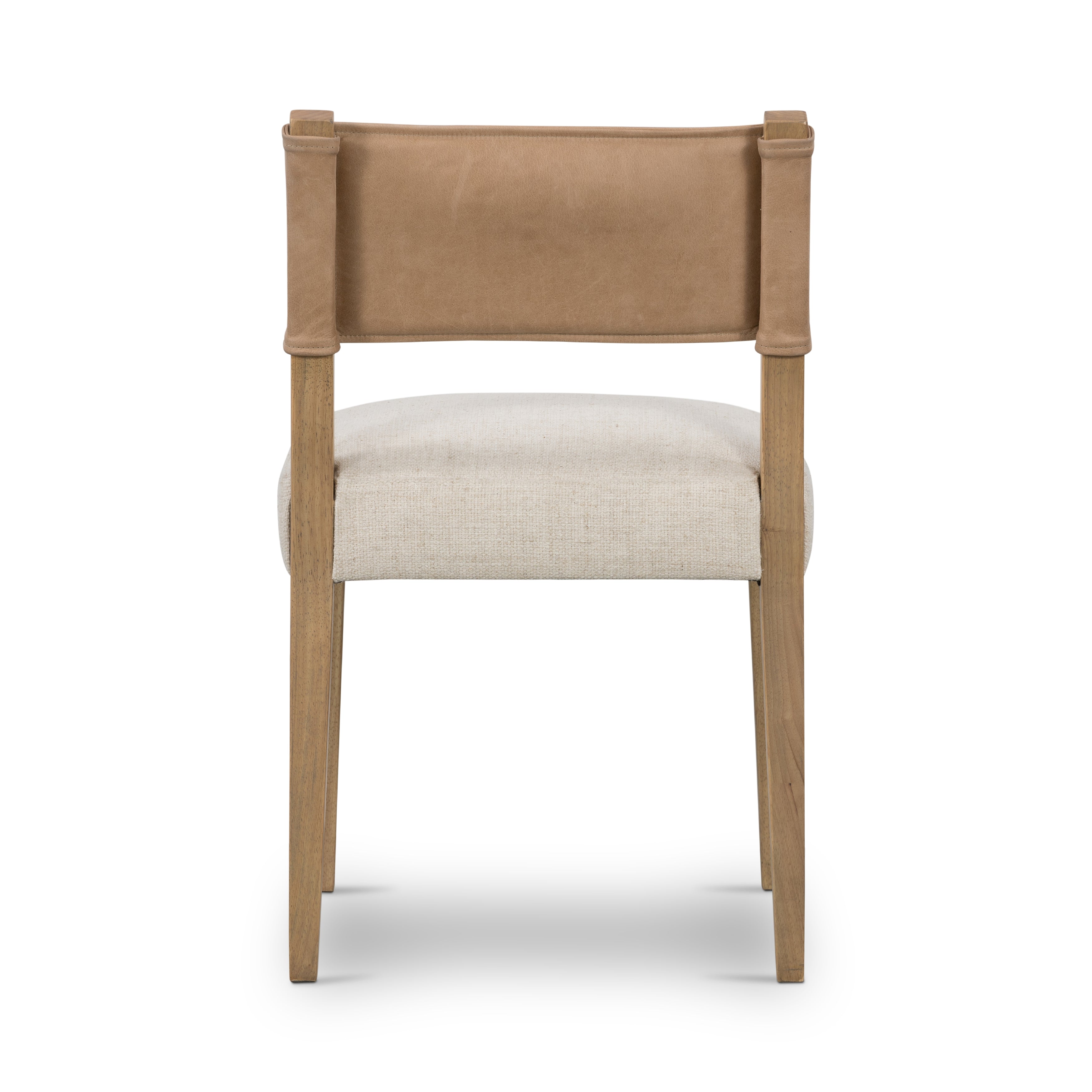 We love the mixed materials found on this Ferris Dining Chair - Winchester Beige. Solid parawood forms a slight, simple frame for squared seating upholstered in high-performance fabric. Tan top-grain leather backing takes this modern-minded dining chair to the next level.  Overall Dimensions: 20.00"w x 21.75"d x 32.00"h