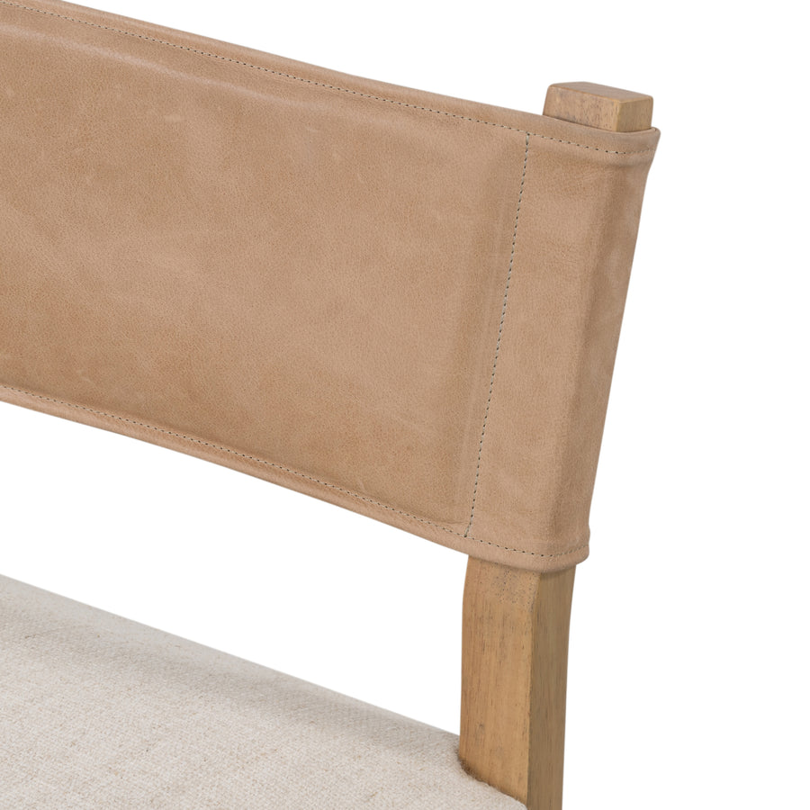 We love the mixed materials found on this Ferris Dining Chair - Winchester Beige. Solid parawood forms a slight, simple frame for squared seating upholstered in high-performance fabric. Tan top-grain leather backing takes this modern-minded dining chair to the next level.  Overall Dimensions: 20.00"w x 21.75"d x 32.00"h