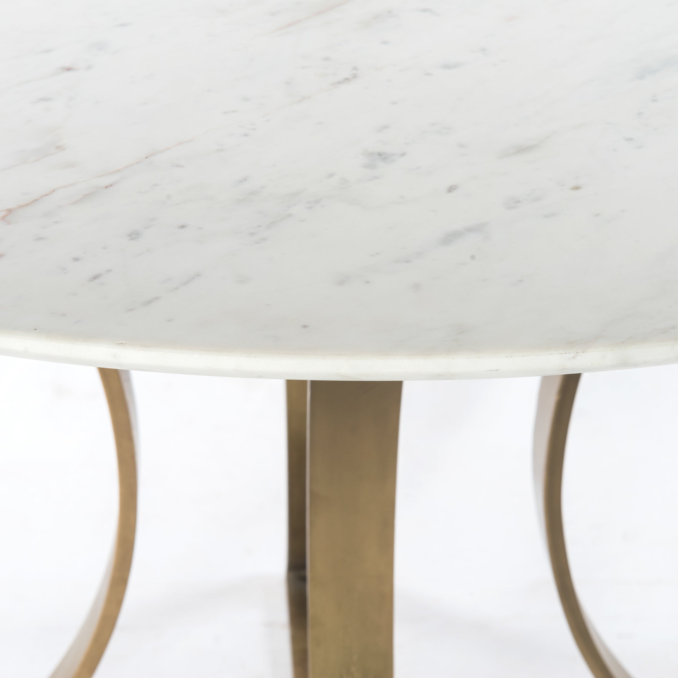 Featuring Gage Dining Table - Polished White Marble by Four Hands at Amethyst Home. Sophisticated materials take a cue from modern geometry. Cast brass iron forms uniquely-curved angles to balance a contrasting polished white marble top. A refined spin on trend-forward design.
Dimensions: 48"W x 48"L x 30"H, or 60"W x 60"L x 30"H 
Colors: Cast Brass, Polished.  Amethyst Home provides interior design, new home construction design consulting, vintage area rugs, and lighting in the Boston metro area.