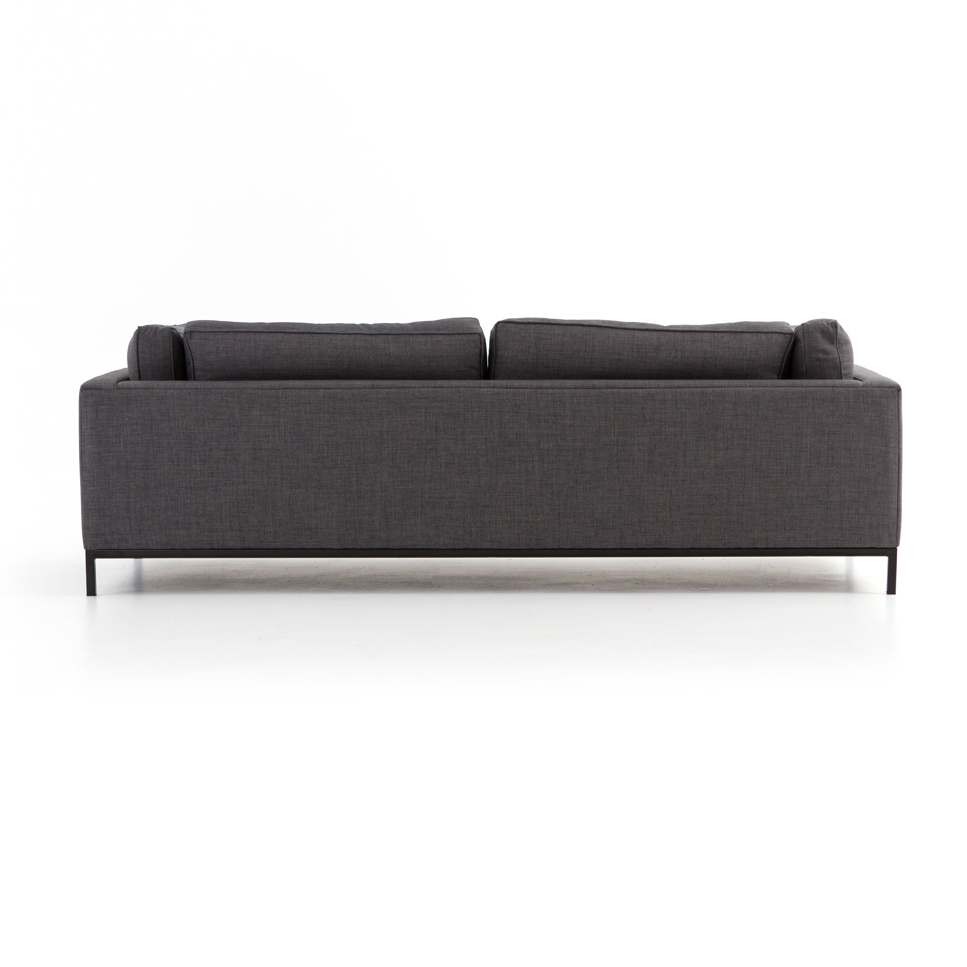 Streamlined yet comfortable!  We loved the subtle piping of the cushion details and stress-free color!  Flexible style, luxurious comfort and family-friendly upholstery. Clean, simple lines and black iron base keep everything casual and chic.  Overall Dimensions: 92.00"w x 38.00"d x 30.00"h