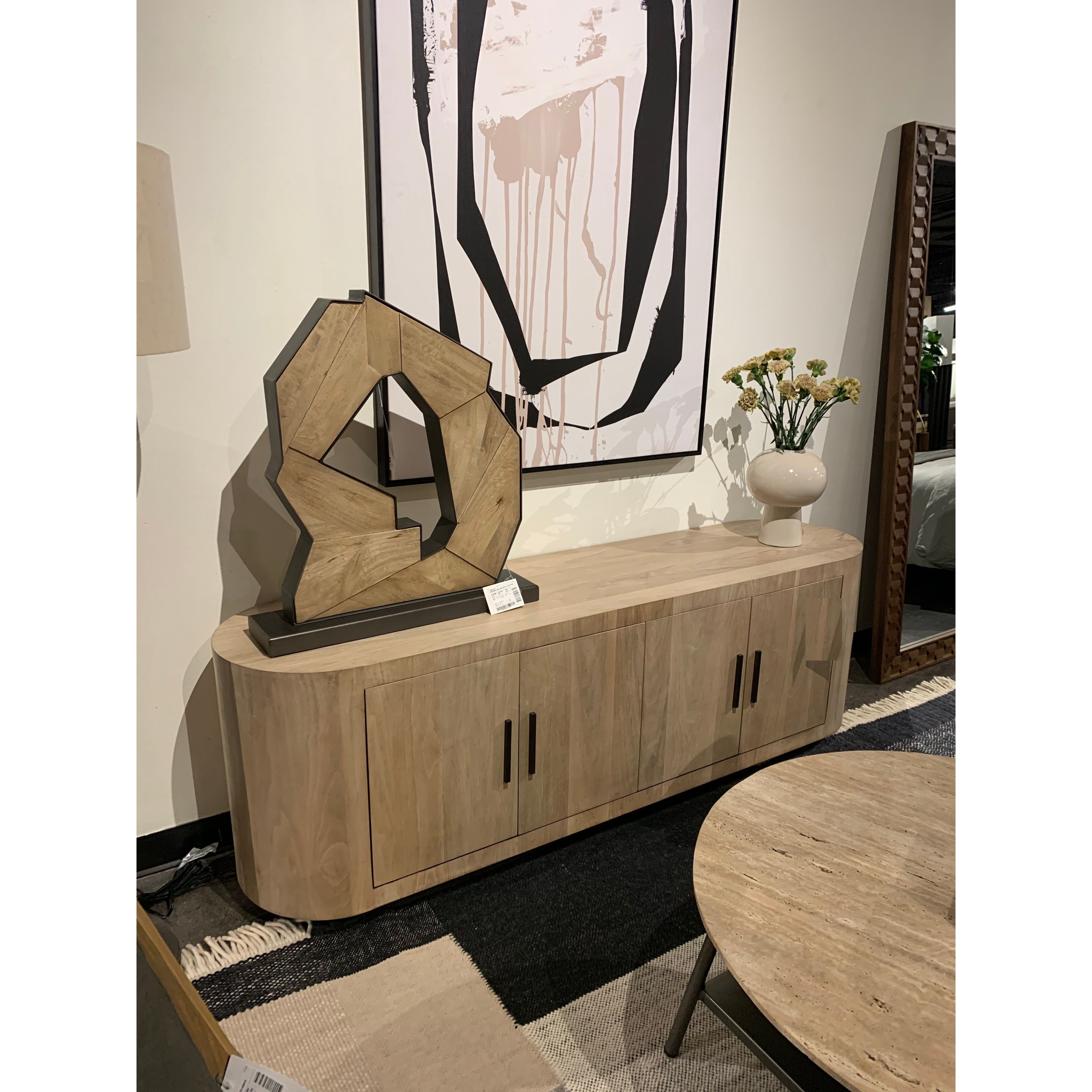 This Hudson Sideboard - Ashen Walnut is a lovely pill-shaped media console that opens to two spacious drawers. The gunmetal handles bring a sleek to look to the piece. Reflective of woods' natural character, a slight color variance is possible. Overall Dimensions: 86.00"w x 20.00"d x 34.00"h