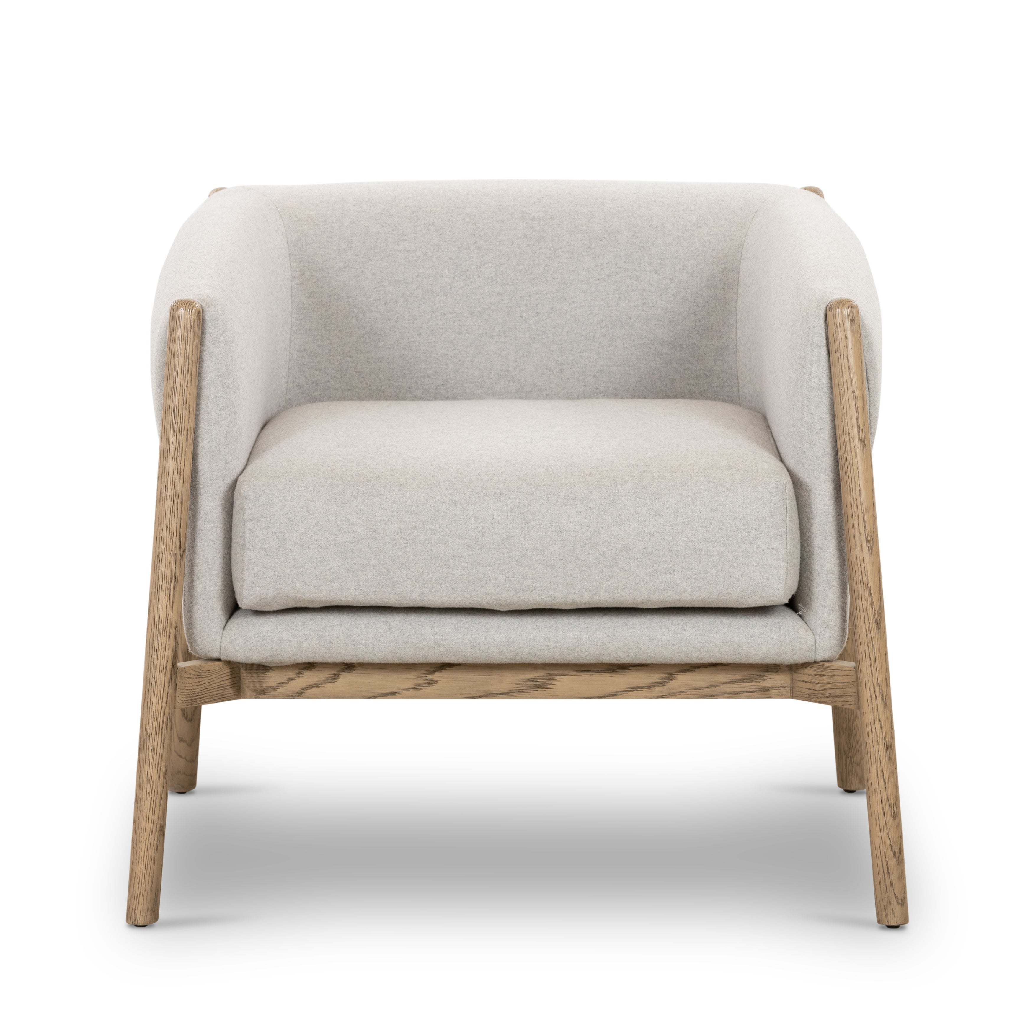 Soft and beautiful, this Idris Chair - Elite Stone is everything. The slightly splayed legs give a subtle intrigue, while the solid oak frame cradles comfy seating of regenerated wool in a light stone hue.   Overall Dimensions: 32.75"w x 32.75"d x 27.25"h