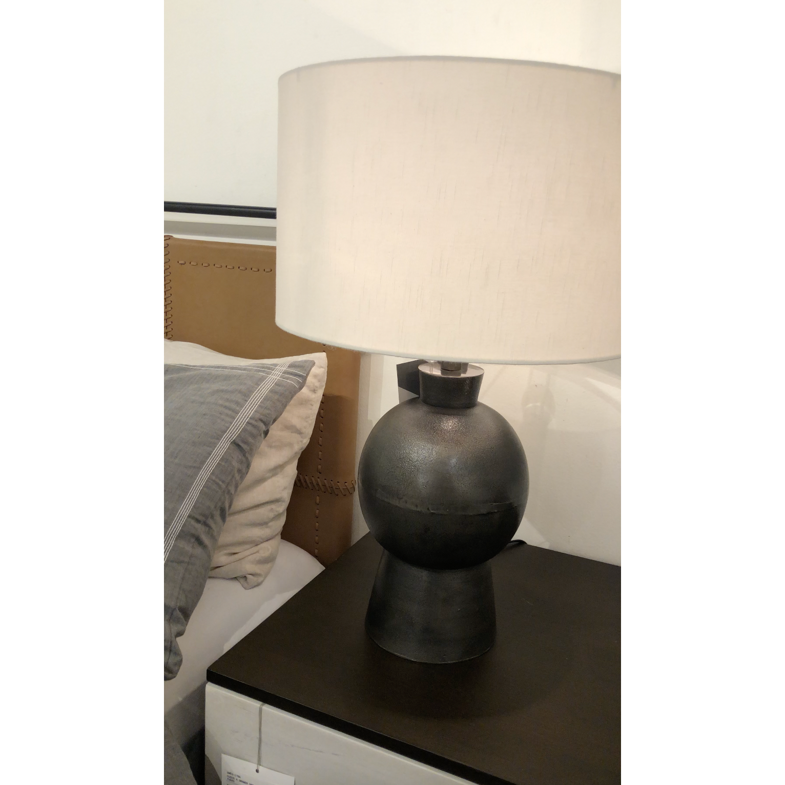 Textured black aluminum forms a shapely base to beautifully complement a white silk shade with this Kelita Table Lamp - Textured Black Alu. A beautiful lamp to place next your bed, sofa, or other area needing extra light.   Overall Dimensions: 16.00"w x 16.00"d x 25.00"h  Colors: Textured Black Aluminum, White Silk Materials: Aluminum, 60%Polyester/40%Viscose