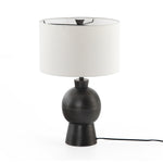 Textured black aluminum forms a shapely base to beautifully complement a white silk shade with this Kelita Table Lamp - Textured Black Alu. A beautiful lamp to place next your bed, sofa, or other area needing extra light.   Overall Dimensions: 16.00"w x 16.00"d x 25.00"h