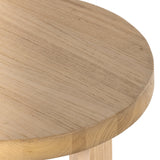 Made from solid natural nettlewood, an open cross-style base supports a thick, rounded tabletop finished with a soft hand on this Liad End Table - Natural Nettlewood. We'd love to see this in your living room or bedroom!  Overall Dimensions: 19.75"w x 19.75"d x 19.75"h