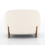 A fresh take on the traditional tub chair, this Lyla Chair - Kerbey Ivory has an exaggerated depth for drama and comfort. Solid rubberwood legs intersect ivory upholstery for clean contrast of color and scale. A comfy, gorgeous chair to add to any living room, office, or other space.   Overall Dimensions: 38.00"w x 33.00"d x 28.00"h