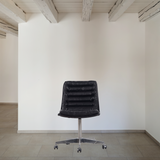 Paired back and fashion-forward, this minimalist Malibu Desk Chair in black top-grain leather offers maximum comfort. Inspired by workspaces of the ‘50s and ‘60s. Stainless steel casters make for stylish ease in the workplace. Height not adjustable.  Overall Dimensions: 20.75"w x 26.25"d x 34.25"h
