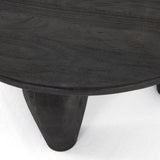 We love the shapely, substantial legs that support a slim, rounded tabletop of light black-finished reclaimed woods in this Maricopa Coffee Table - Dark Totem. A global, organic look with a handcrafted vibe.