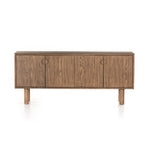 This Mattia Sideboard - Toasted Natural Oak has a warm, toasted finish with rounded dowel legs of solid parawood. Roomy interior with adjustable shelving awaits storage of serving ware and table linens -- bonus points for rear cutouts for cord management!   Overall Dimensions: 74.00"w x 17.00"d x 32.00"h