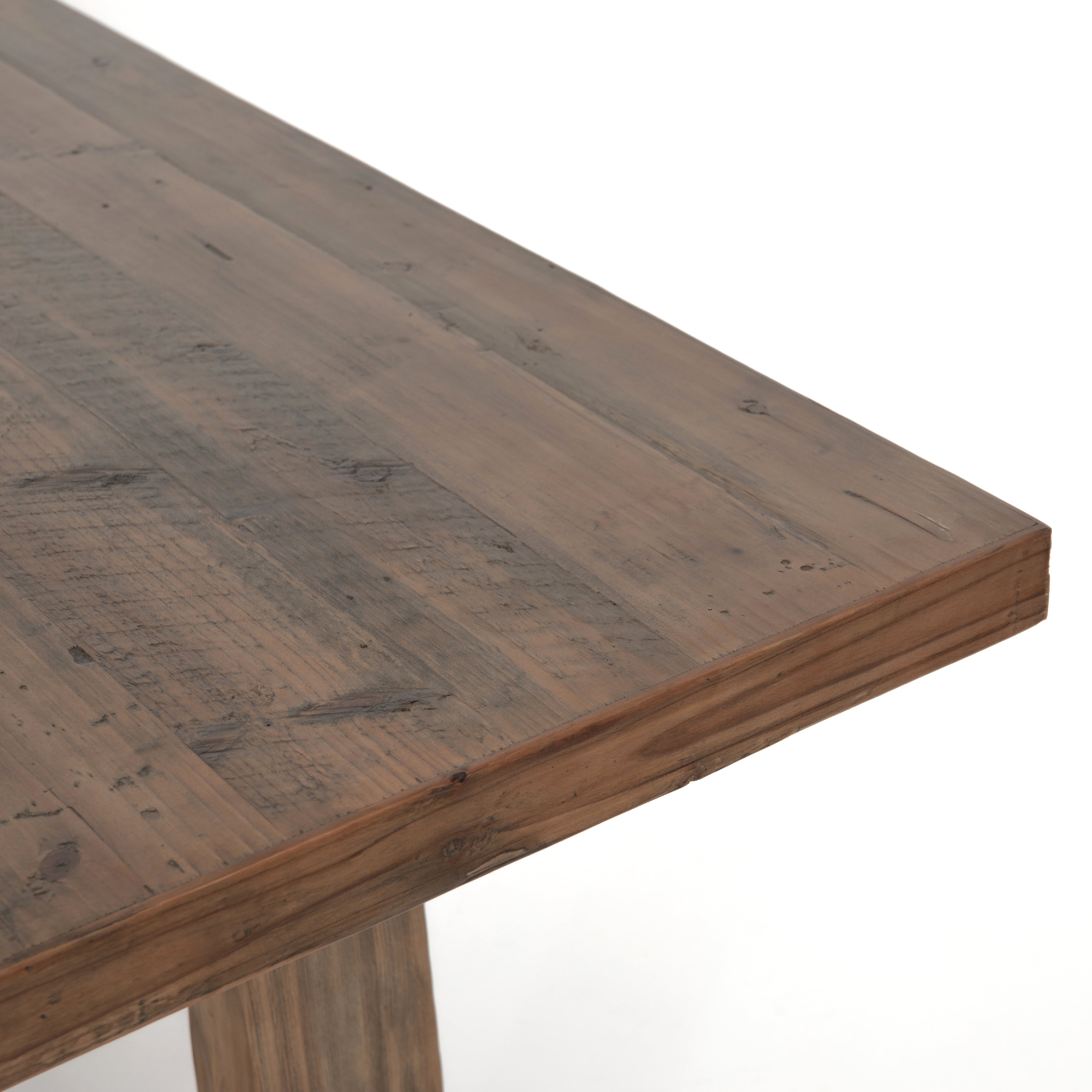 Bring a traditional sense to the table with this Otto Dining Table - 110". Finished in a warm honey hue, a trestle-style base of reclaimed pine supports a rectangular top of pine, waxed and bleached for a rustic look with natural depth.