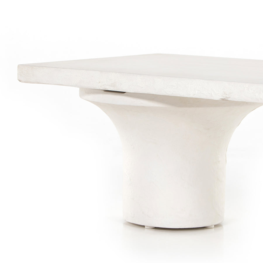Make a monolithic statement with this Parra Coffee Table - Plaster Molded Concrete. Made from plaster-molded concrete, the pedestal-style legs support a rectangular tabletop of smooth, white-finished concrete, for a clean, adobe-inspired look.  Overall Dimensions: 59.75"w x 24.00"d x 15.00"h