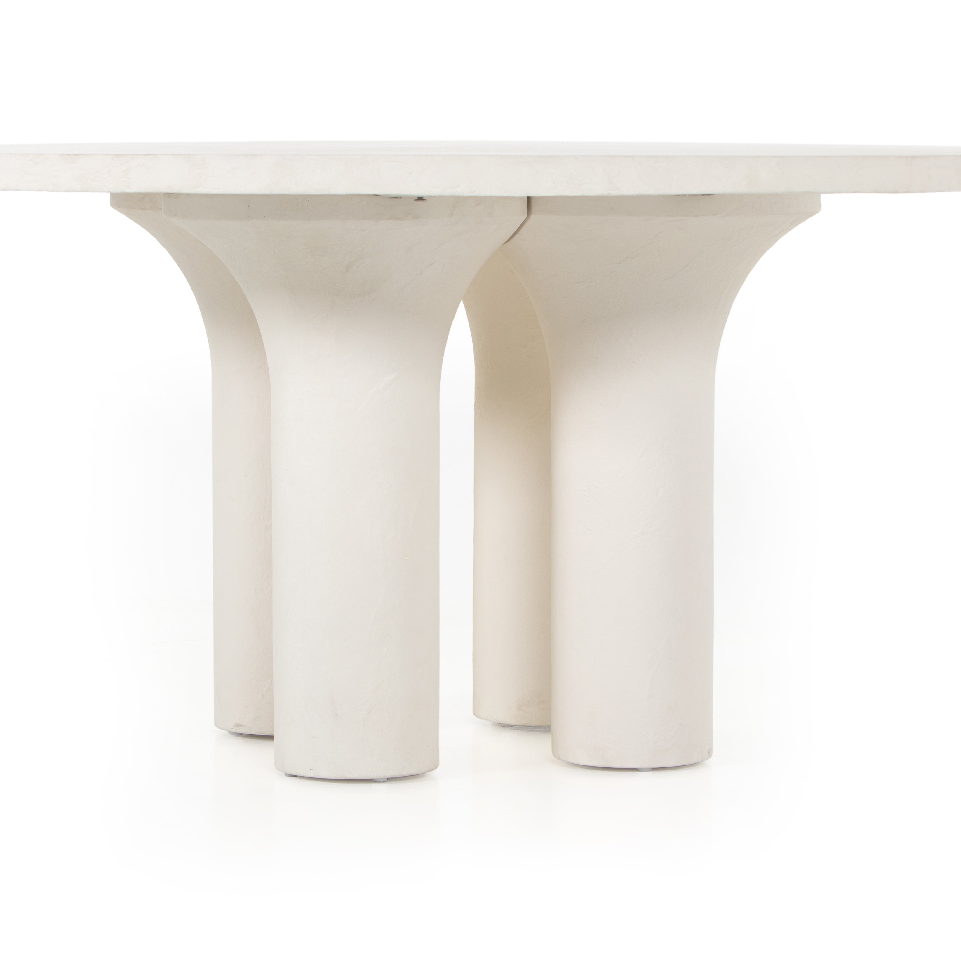 This Parra Dining Table - Plaster Molded Concrete is made from plaster-molded concrete with a cylindrical pillar-style base tapering slightly to support a smooth, white-finished tabletop. We love the texture and brightness this brings to any dining room or kitchen area.   Overall Dimensions: 59.75"w x 59.75"d x 30.00"h
