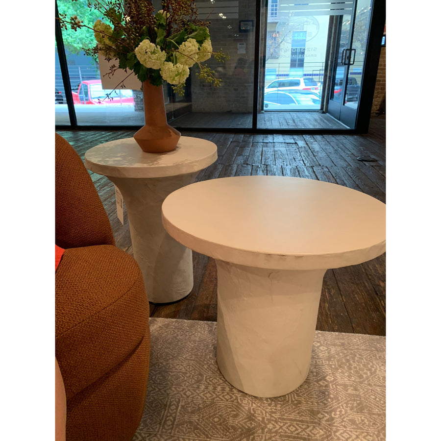 Made from plaster-molded concrete, a pedestal-style base supports a rounded tabletop of smooth, white-finished concrete in this Parra Low End Table - Plaster Molded Concrete. This brings a clean, adobe-inspired vibe to any living room or lounge area. Pair with the matching High End Table for a staggered look!   Overall Dimensions: 20.00"w x 20.00"d x 18.00"h