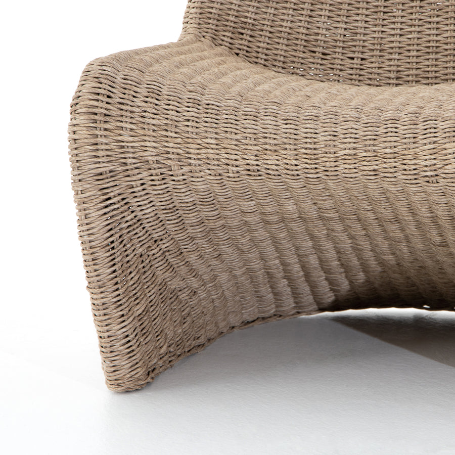 This Portia Outdoor Occasional Chair - Vintage White features a unique shape for comfortable seating. Finished in a vintage white, all-weather wicker makes this the perfect chair for indoors or out.  Cover or store inside during inclement weather and when not in use.  Overall Dimensions: 28.00"w x 33.75"d x 33.50"h