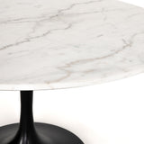 We love the mixed materials found in this Powell Dining Table - White Marble. Classic tulip shaping is recast with a rustic black iron base and rounded top of white marble - a perfect addition to any dining room or kitchen!   Overall Dimensions: 55.00"w x 55.00"d x 29.50"h  Colors: Dark Rustic Black, Weathered Ash, White Marble Materials: Iron, Solid Oak, Solid Marble Weight: 306.44 lb Volume: 34.29 cu ft