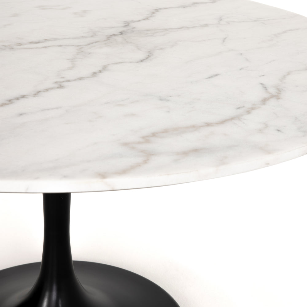 Featuring Powell 55" Dining Table - White Marble by Four Hands at Amethyst Home. We love the mixed materials found in this Powell Dining Table - White Marble. Classic tulip shaping is recast with a rustic black iron base and rounded top of white marble - a perfect addition to any dining room or kitchen! 
Overall Dimensions: 55"W x 55"L x 29.50"H
Colors: Da.  Amethyst Home provides interior design, new home construction design consulting, vintage area rugs, and lighting in the Charlotte metro area.