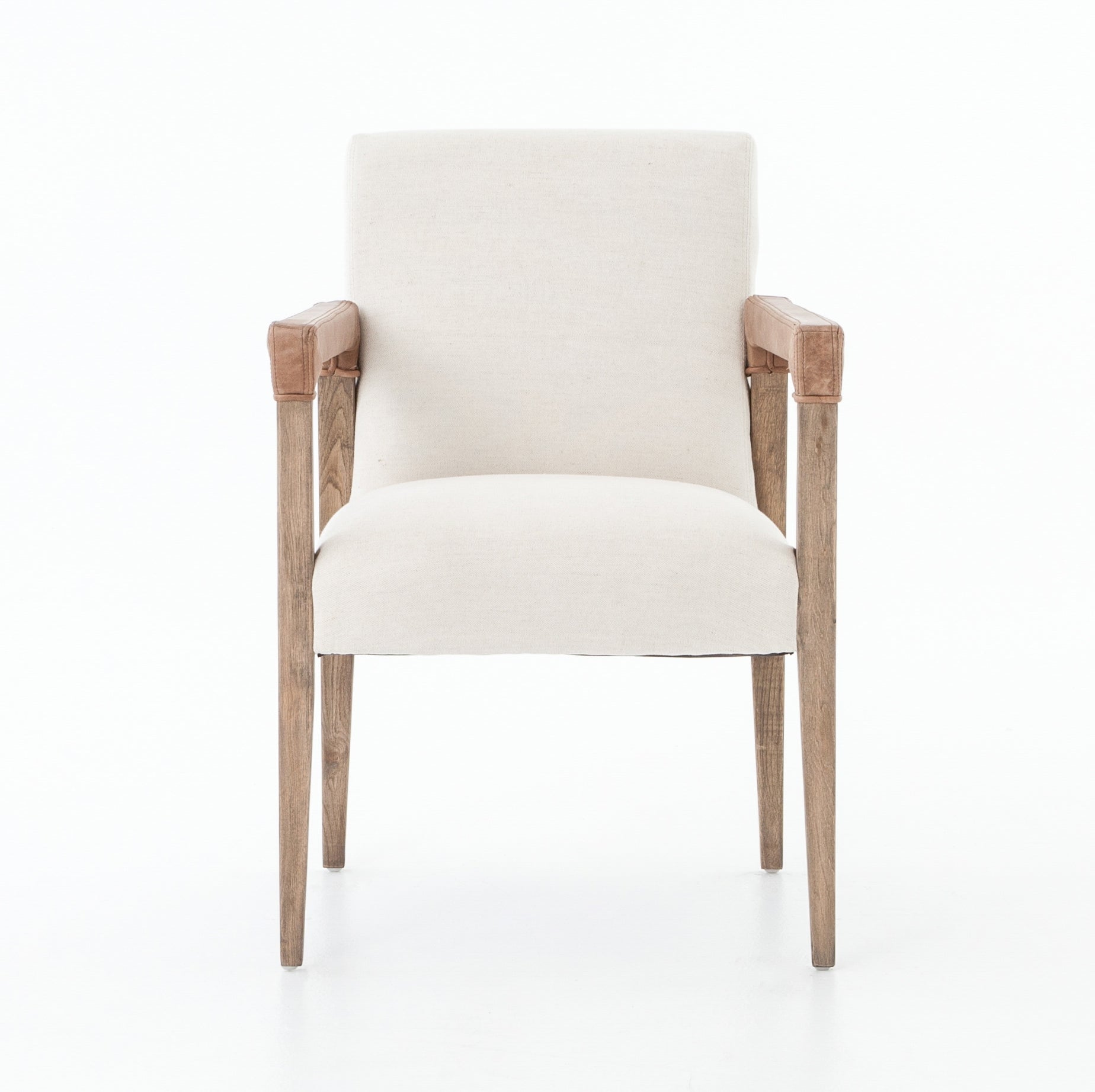 Elegance is no exaggeration with this Reuben Dining Chair - Harbor Natural. Slim, tapered oak with arms wrapped in vintage leather frames a floating seat covered in natural linen. We'd love to see this in your dining room, kitchen, or other space!  Overall Dimensions: 23.25"w x 25.50"d x 33.75"h