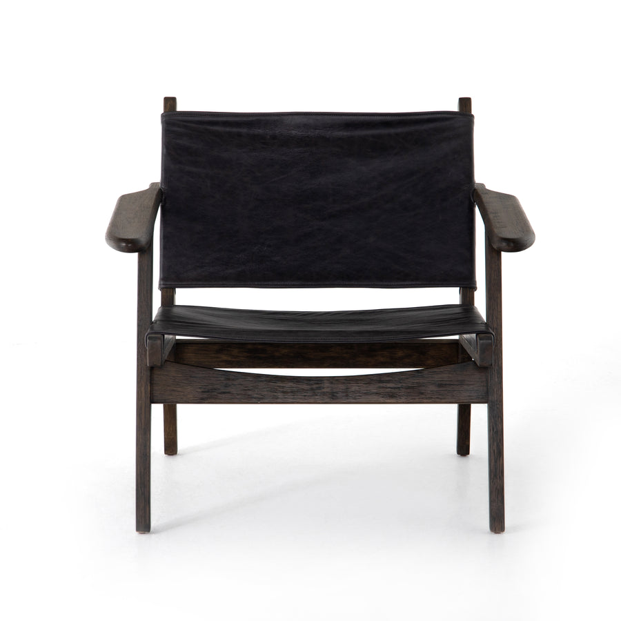 Low, cool, and casual with this Rivers Sling Chair - Sonoma Black. Sling seating of black top-grain leather is framed by warm-finished parawood, for an edgy, effortless look for any office, living room, or other area.   Overall Dimensions: 31.50"w x 31.00"d x 28.75"h