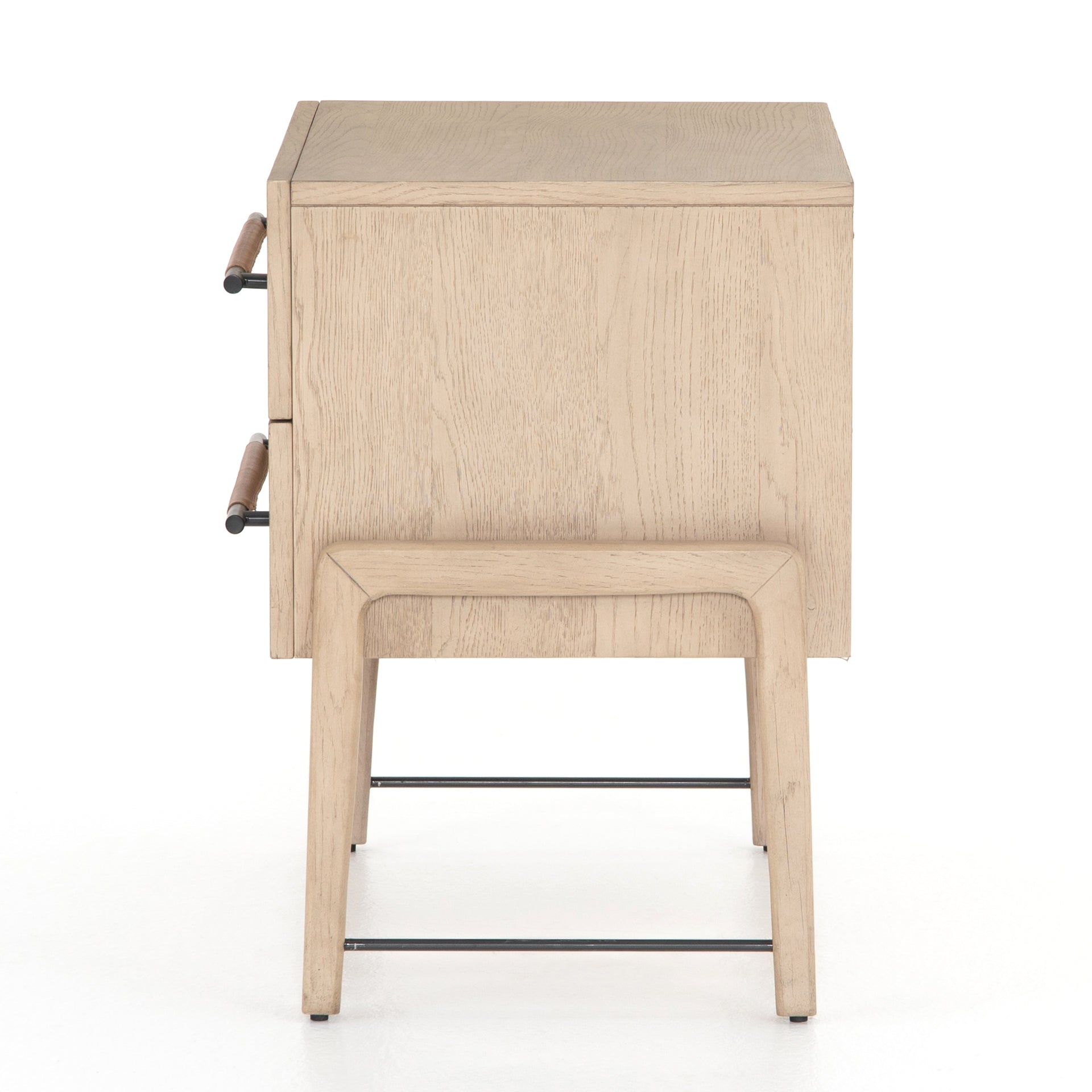 The light-finished oak of this Rosedale Nightstand brings a clean, brightness to any room. We love how the two spacious drawers have iron hardware wrapped in a gorgeous, tan leather. The dimension legs with iron connecting them bring a unique look to your bedroom or other area! Overall Dimensions: 27.25"w x 19.50"d x 26.00"h Materials: Oak Veneer, Top Grain Leather, Iron, Solid Oak