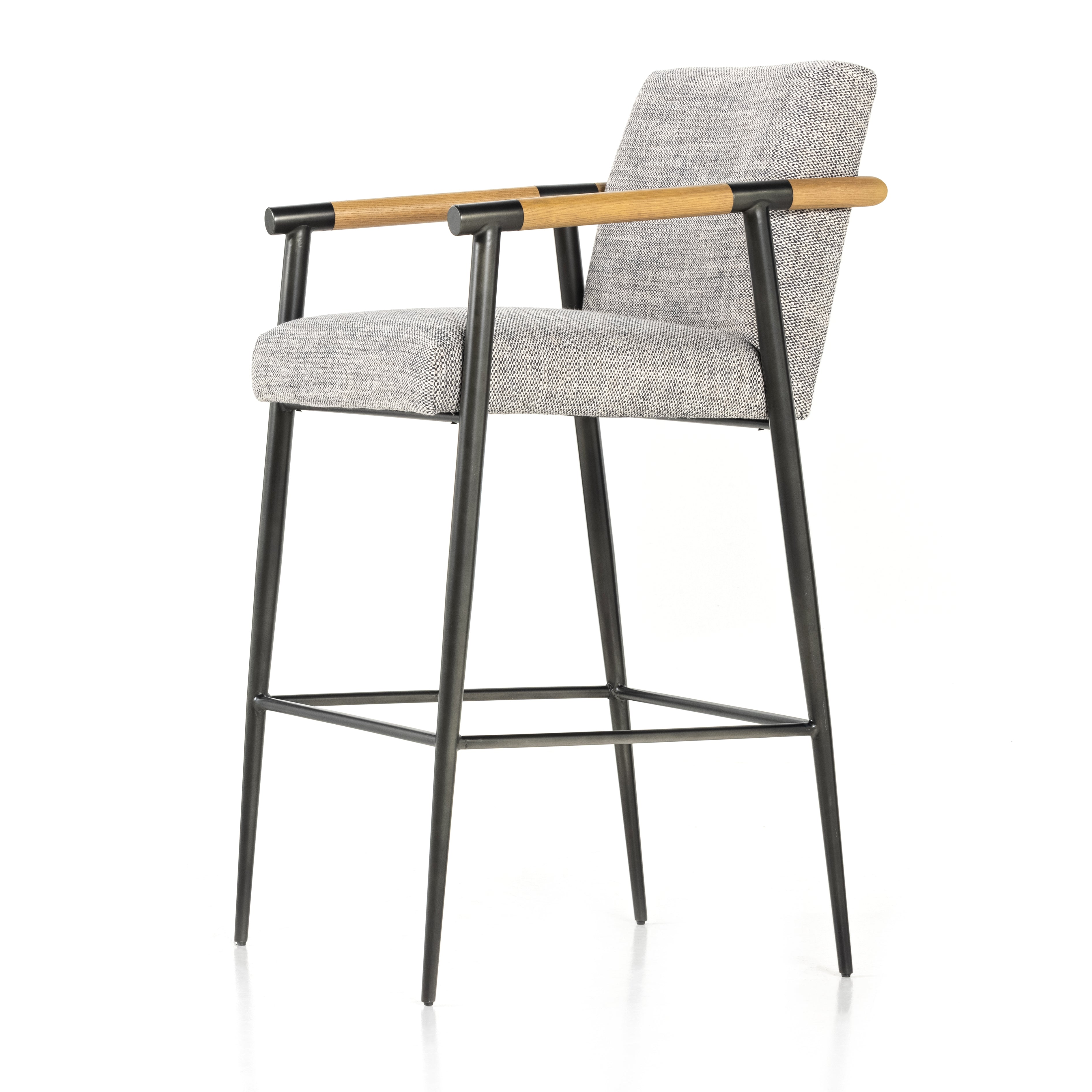 We love the textural grey seating upholstered in a high-performance fabric on this Rowen Bar + Counter Stool - Thames Raven. The angular solid oak arms and black-finished stainless steel framing is perfectly sized to elevate your bar or counter space. 