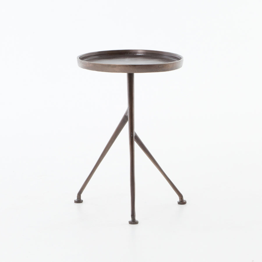 We love the cleverly balanced twist of this Schmidt Accent Table. Angular cast aluminum is finished in antique rust to bring out highs and lows. Great indoors or out— cover or store indoors during inclement weather and when not in use.  Overall Dimensions: 18.00"w x 14.00"d x 20.00"h