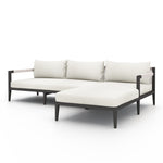 We love the rope-arm detail on this Sherwood Outdoor 2 Piece Sectional - Natural Ivory. Bronze-finished aluminum forms a linear frame for UV-resistant and water-repellent Sunproof fabric in an inviting ivory - sure to elevate the look of an patio or pool side area!   Cover or store indoors during inclement weather.  Overall Dimensions: 94.50"w x 68.50"d x 24.50"h