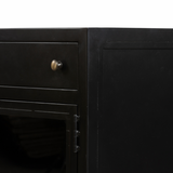 This Shadow Box Media Console Table gives your inner collector a place to play. Frame prized posessions in a glass enclosure with matte-black metal and brass knobs.  Size: 69.00"w x 19.00"d x 29.25"h  Colors: Black, Tempered Glass Materials: Iron, Tempered Glass