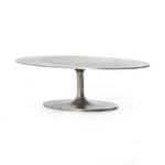 We love the oval shape of this Simone Coffee Table - Antique Nickel. The textural cast aluminum makes for a beautifully modern coffee table, with alluring highs and lows played up by a raw nickel finish. Great indoors or out; cover or store indoors during inclement weather and when not in use.  Overall Dimensions: 54.75"w x 29.25"d x 16.50"h