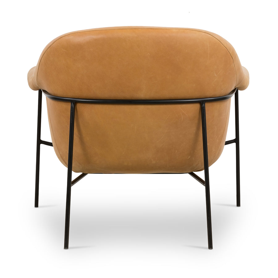 With a curvy silhouette and classic rolled arms, this Suerte Chair - Palermo Butterscotch has butterscotch leather that lends a fresh feel to vintage-inspired accent seating. The airy iron cradle base brings a beautiful balance of scale to any living room or office!  Overall Dimensions: 35.00"w x 33.50"d x 31.00"h