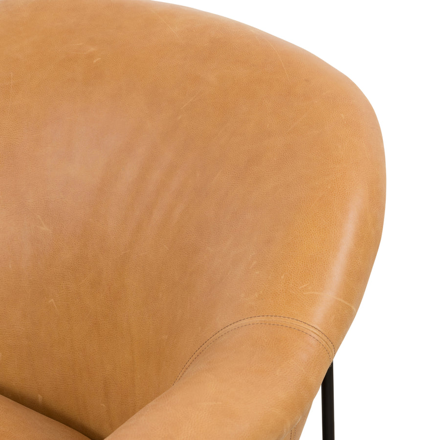 With a curvy silhouette and classic rolled arms, this Suerte Chair - Palermo Butterscotch has butterscotch leather that lends a fresh feel to vintage-inspired accent seating. The airy iron cradle base brings a beautiful balance of scale to any living room or office!  Overall Dimensions: 35.00"w x 33.50"d x 31.00"h