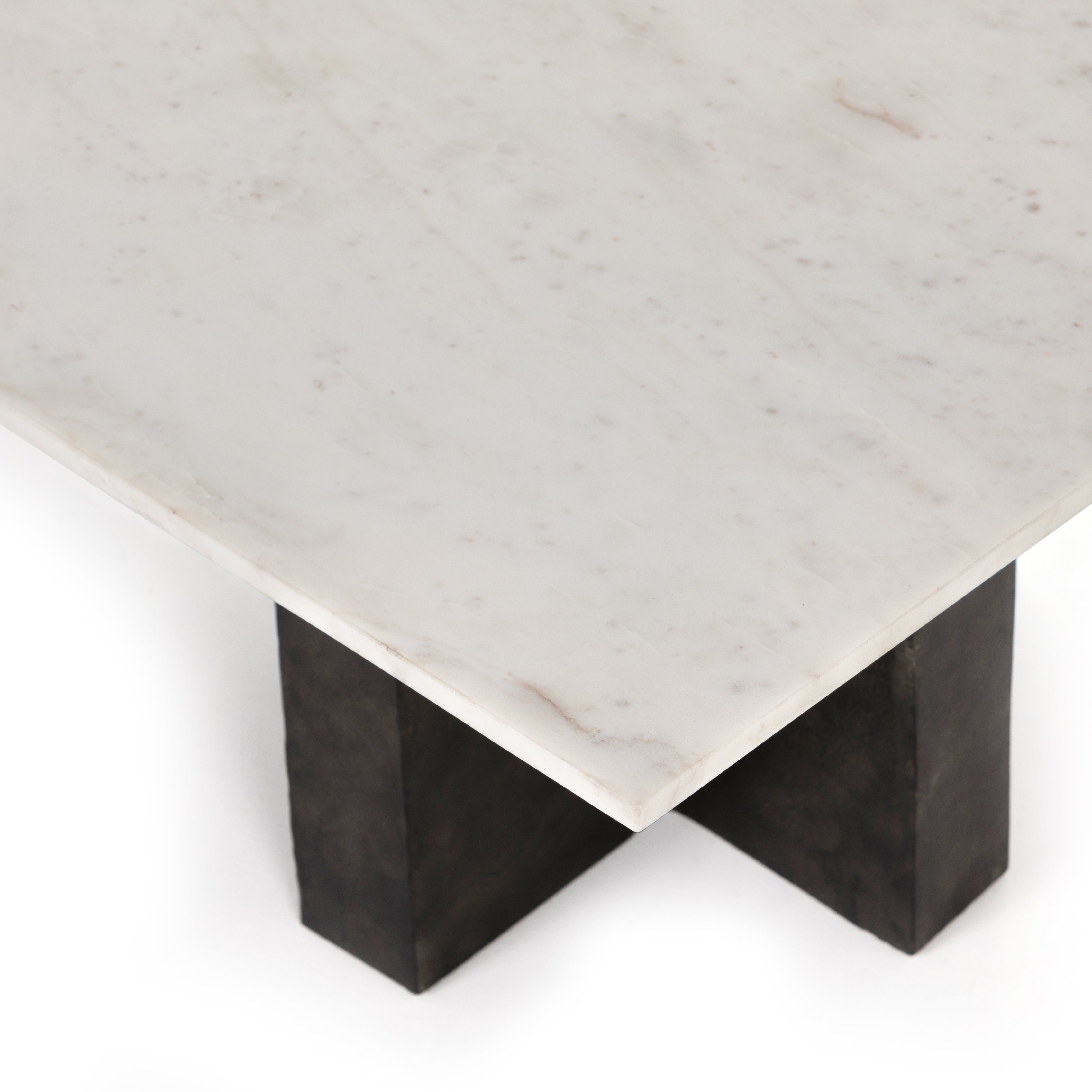 We love the legs of this Terrell Coffee Table - Raw Black. Finished in a raw black, uniquely angular cast aluminum legs support a rectangular tabletop of solid marble in a clean, polished white - a sleek, modern look to add in any living room or lounge area.   Overall Dimensions: 55.00"w x 29.00"d x 16.50"h