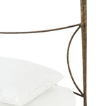 Beguiling curves soften hard materials for marked drama with this Westwood Bed. Slim, hammered iron is finished in antique brass for depth that defies this frame's feminine air. Low-profile box spring recommended.