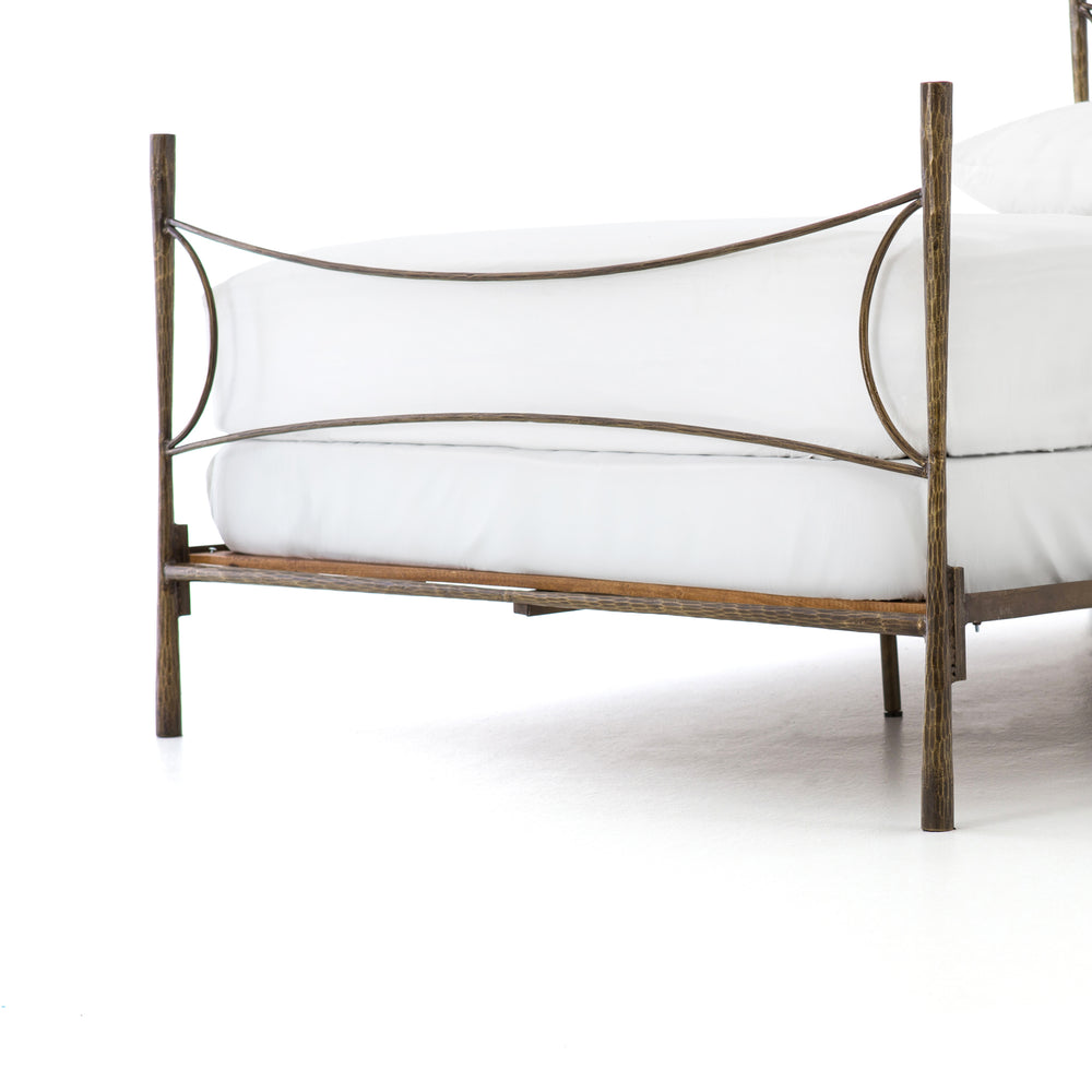 Featuring Westwood Bed by Four Hands at Amethyst Home. Beguiling curves soften hard materials for marked drama with this Westwood Bed. Slim, hammered iron is finished in antique brass for depth that defies this frame's feminine air. Low-profile box spring recommended.
Colors: Antique BrassMaterials: Iron
Queen Overall Dimensions:  62.00"w x 84.00"d x 51.0.  Amethyst Home provides interior design, new home construction design consulting, vintage area rugs, and lighting in the Des Moines metro area.