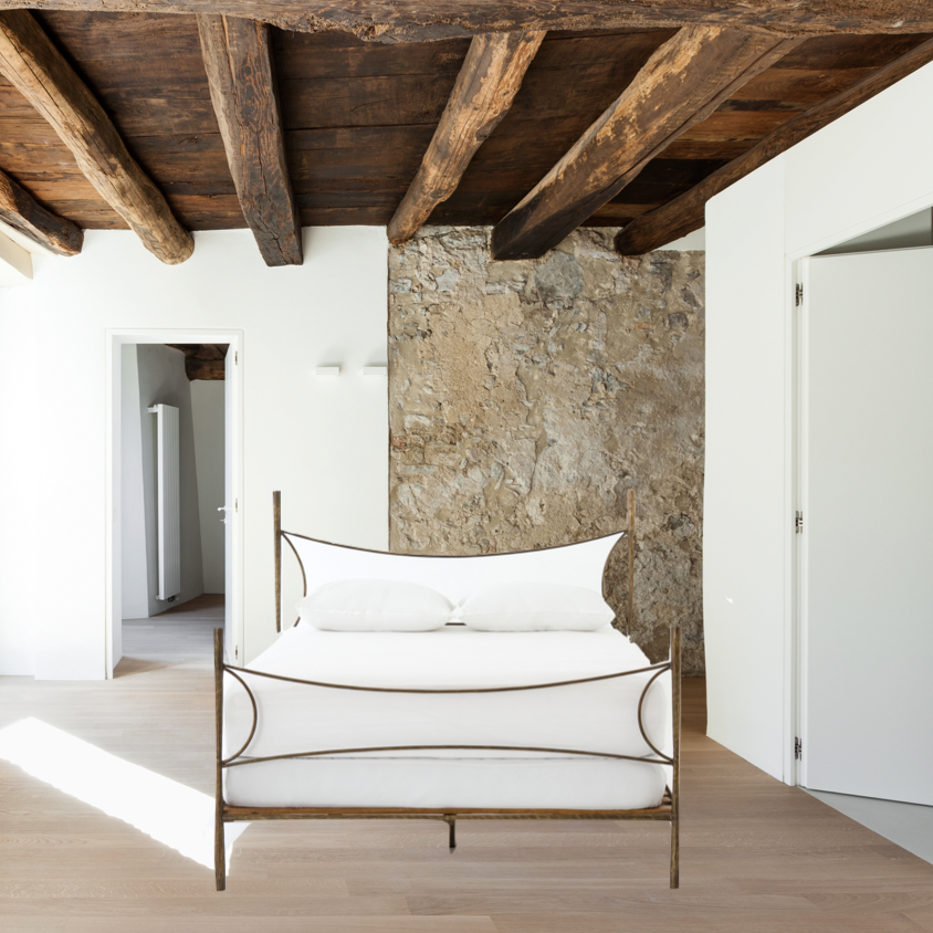 Featuring Westwood Bed by Four Hands at Amethyst Home. Beguiling curves soften hard materials for marked drama with this Westwood Bed. Slim, hammered iron is finished in antique brass for depth that defies this frame's feminine air. Low-profile box spring recommended.
Colors: Antique BrassMaterials: Iron
Queen Overall Dimensions:  62.00"w x 84.00"d x 51.00"hBo. Amethyst Home provides interior design, new home construction design consulting, vintage area rugs, and lighting in the Boston metro area.