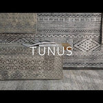 The Tunus Silver Rug features a globally inspired design made from wool. The hand-knotted rug adds wabi sabi charm to any room. Amethyst Home provides interior design, new home construction design consulting, vintage area rugs, and lighting in the Miami metro area.