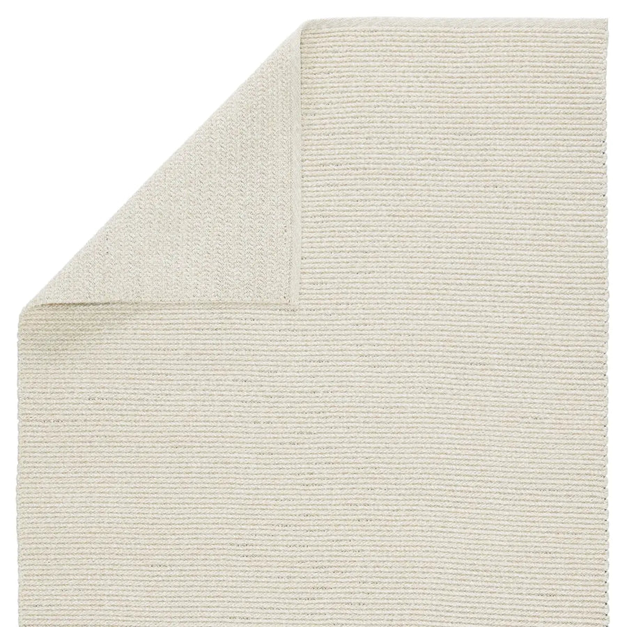 The Brayden Raynor Area Rug by Jaipur Living features a beige and ivory colorway that anchors spaces with a light and airy tone. Handwoven of durable polypropylene, this braided rug an easy-to-clean and weather resistant option that complements fresh, Scandinavian interiors and casual, sophisticated outdoor areas alike