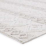 The handwoven Cosette Adelie Area Rug by Jaipur Living showcases a boucle-style geometric design in a light and airy colorway of white and soft gray. Crafted of PET yarn, or recycled plastic, this chic and durable rug brings warmth and a hint of global appeal to indoor and outdoor spaces alike.
