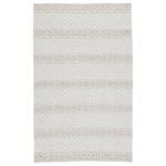 The handwoven Cosette Adelie Area Rug by Jaipur Living showcases a boucle-style geometric design in a light and airy colorway of white and soft gray. Crafted of PET yarn, or recycled plastic, this chic and durable rug brings warmth and a hint of global appeal to indoor and outdoor spaces alike.