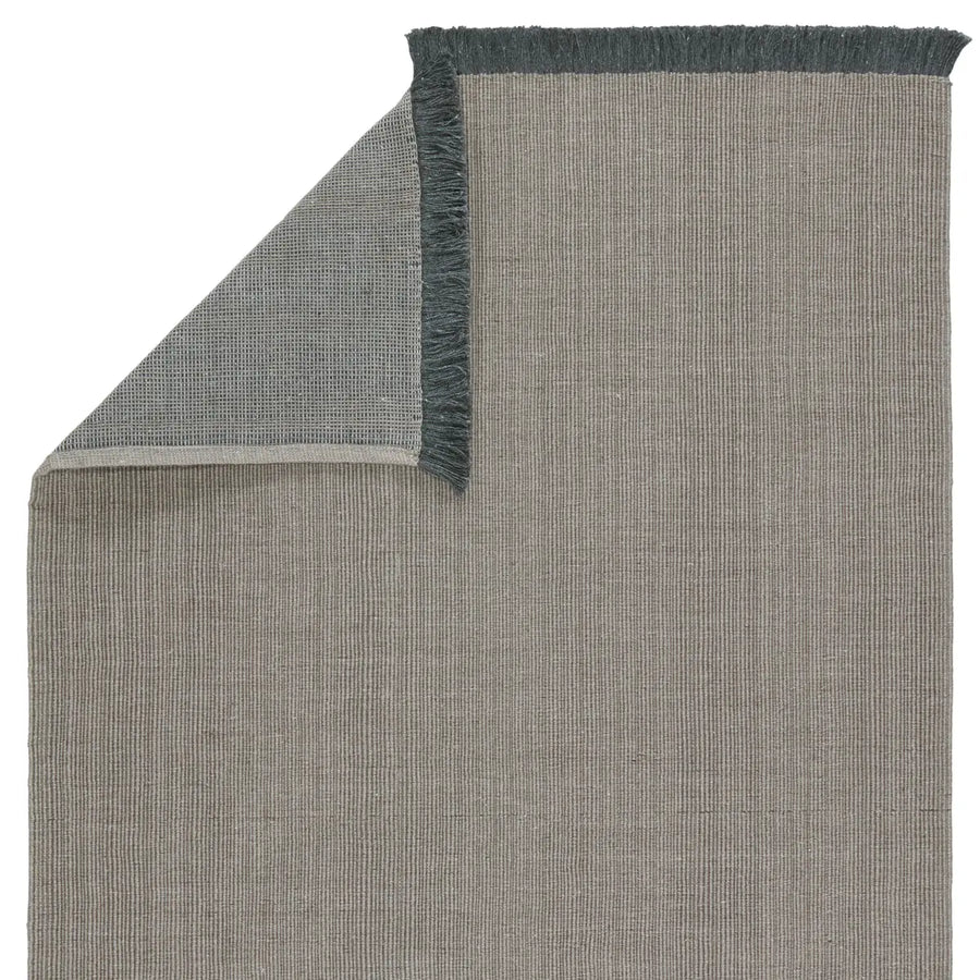 This Drezden Engild Vintage Khaki Area Rug by Jaipur Living grounds both indoor and outdoor spaces with neutral, understated style that complements a range of looks and decor. Crafted of PET, or recycled plastic bottles, this accent piece perfect for high traffic areas like patios, living rooms, entryways, or halls.