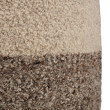 This Folke Micco Partridge Pouf by Jaipur Living boasts the soft and inviting texture of the on-trend shearling look. Crafted of wool, the cylinder Micco pouf showcases boucle details and a color-blocked design. The heathered brown and cream colorway offers a perfectly neutral palette to modern interiors. 