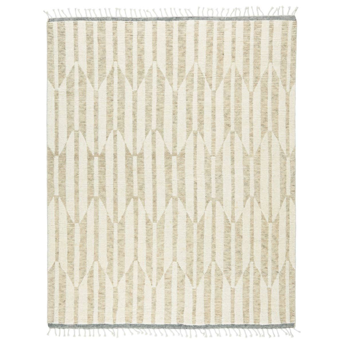 The Keoka Quest Area Rug by Jaipur Living, or KEO01 features tones of beige, light gray, and ivory. The light and airy colorway of the Quest rug anchors room with versatility and neutral appeal. The texture-rich wool pile features a ribbed construction that lends unique linear details to the dynamic geometric patterns.