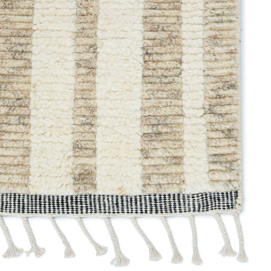 The Keoka Quest Area Rug by Jaipur Living, or KEO01 features tones of beige, light gray, and ivory. The light and airy colorway of the Quest rug anchors room with versatility and neutral appeal. The texture-rich wool pile features a ribbed construction that lends unique linear details to the dynamic geometric patterns.
