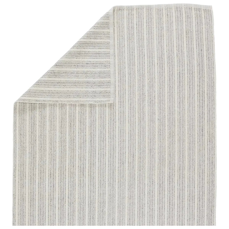 The Morae Elis Area Rug by Jaipur Living offers a delicate stripe pattern in on-trend hues of gray and ivory. The 100% polyester make creates a kid and pet friendly accent piece. This handwoven rug fits easily in high traffic areas like patios, laundry rooms, kitchens, living rooms, entryways, or halls.