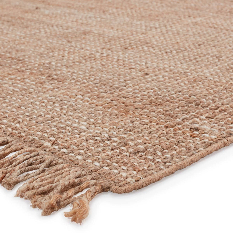 This Jaipur Living Naturals Lucia Sauza Area Rug, or NAL08, is a natural jute area rug offering a chunky weave foundation to transitional spaces. This casually elegant layer lends an earthy accent in a duo-toned ivory and beige colorway. The knotted fringe lends global charm to this handwoven design. 