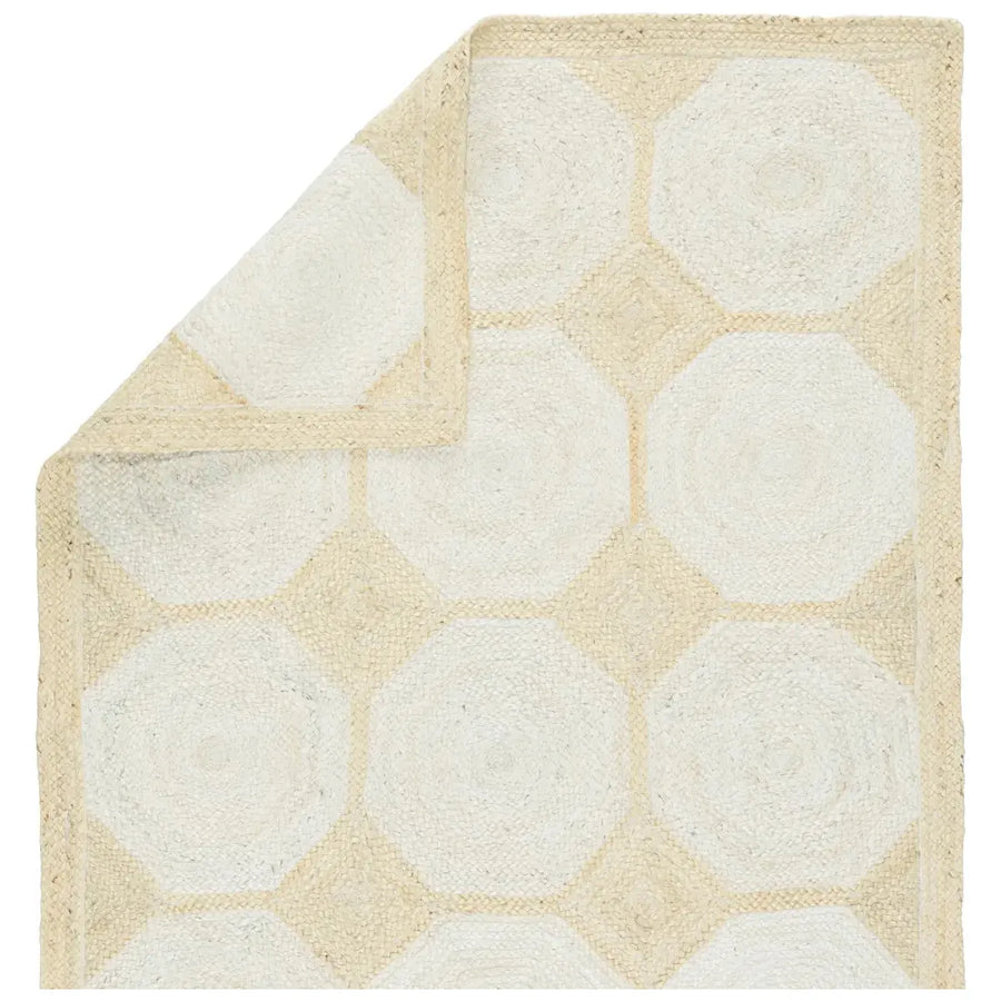 The Naturals Tobago Fiorita Area Rug by Jaipur Living provides a staple to transitional homes with a neutral colorway and organic style. A rectangular border frames the intricately woven, bleached octagonal design for a modern coastal look.