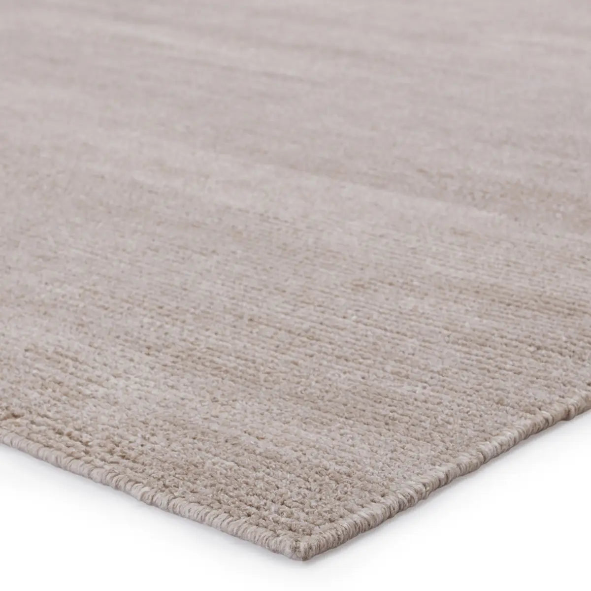 The eco-friendly Rebecca Feather Gray Area Rug by Jaipur Living delivers a fresh accent to patios, kitchens, and dining rooms with its ultra-durable PET yarn handwoven construction. The light taupe colorway grounds any room or area with a fresh, neutral style.