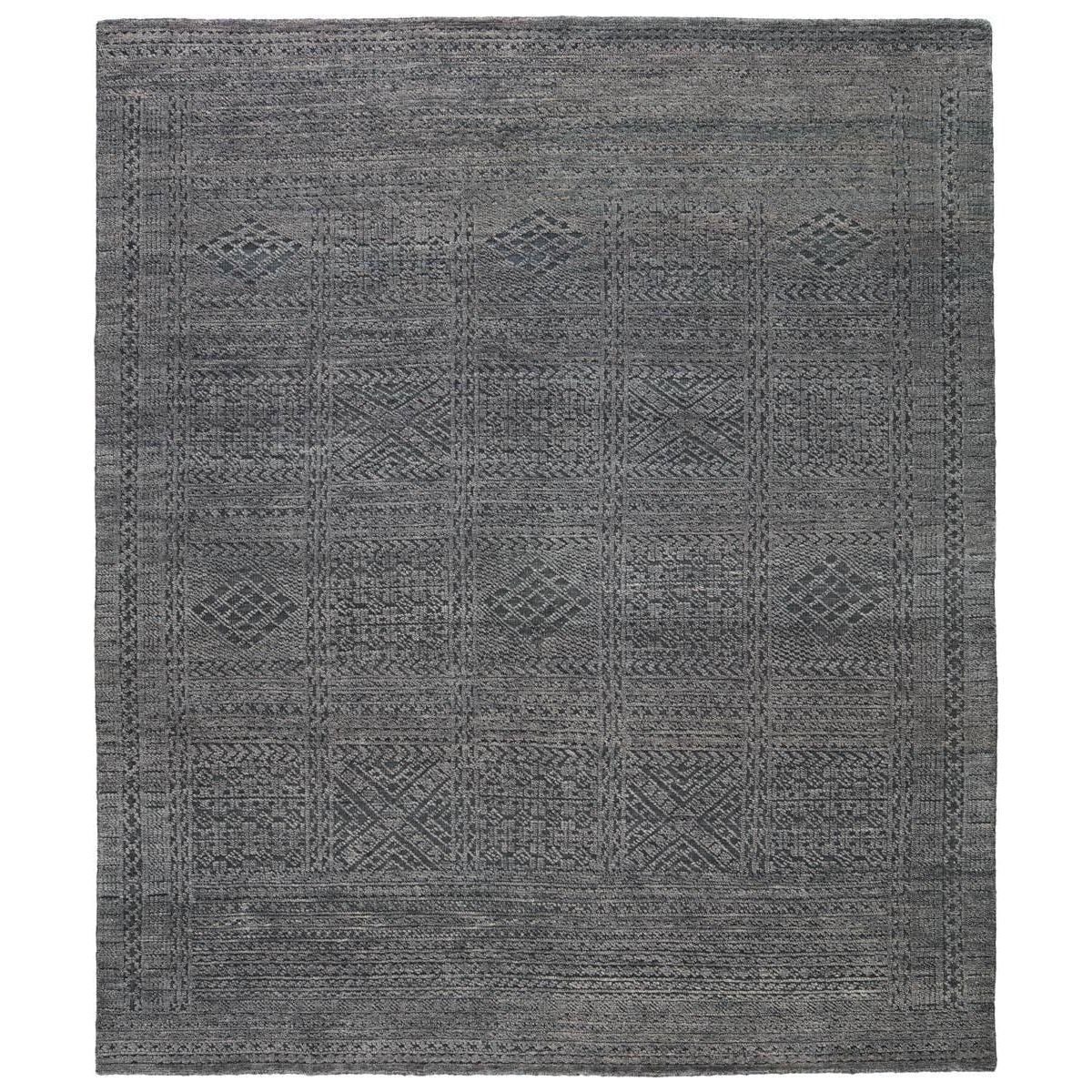 The Reign Jadene Area Rug by Jaipur Living, or REI14, is a knotted area rug grounded by deep black and tonal green hues. The tribal pattern makes a stunning and statement in any space. This artisan-made rug boasts a carved, textural pile that lends depth and dimension to the deep tones of the wool.