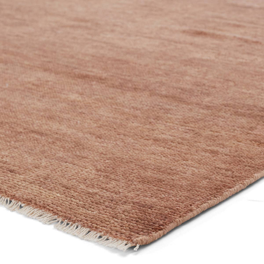 The Jaipur Living Saga Thrush Smoke Grey Origin Area Rug, or SAG06, lends balance and a relaxed, grounding vibe to modern interiors. The Origin area rug anchors a space with a solid, subtly striated design in a warm brown colorway. Hand knotted by skilled artisans, this durable wool accent marries simplicity and luxury.