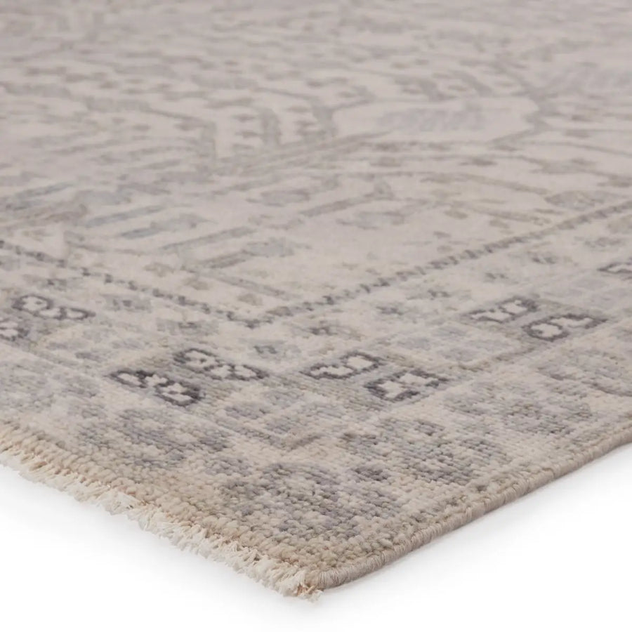 The Salinas Cosimo Area Rug by Jaipur Living is punctuated by traditional, intricate details and a soft, hand-knotted wool construction. This durable, artisan-made rug features a border detail and floral accents in a tonal gray colorway.