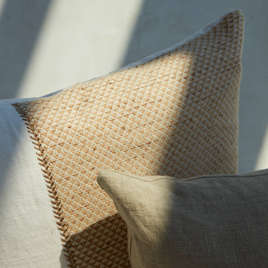 Sophisticated simplicity defines the texturally inspiring Taiga collection. Crafted of soft linen, viscose, and cotton, the Sila pillow boasts a mix of pattern-rich and embroidered details. Golden and white tones lend a bright and airy vibe to any bedroom, living room, or othe area.   Size: 22" x 22"
